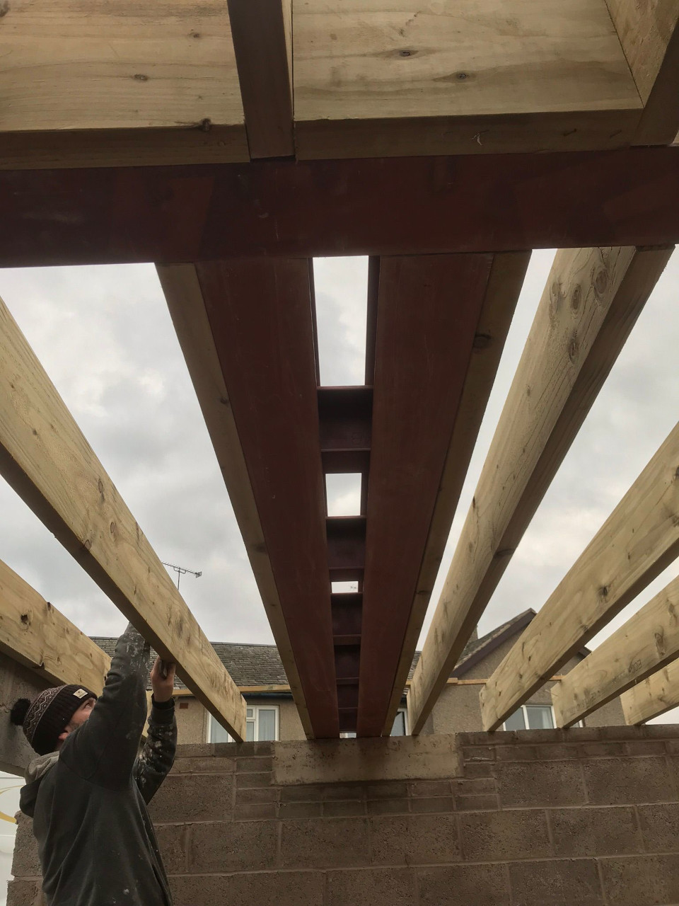 Install joists for flat roof.